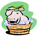 Smiling hippo having bubble bath in wooden tub