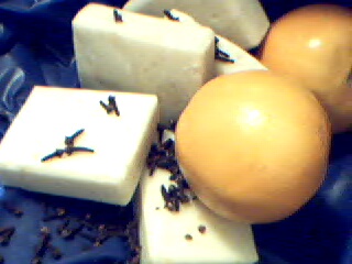 Bars of soap and oranges sprinkled with cloves